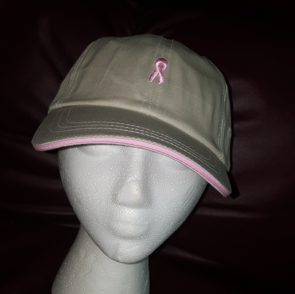 Ball cap.  Tan color hat. Pink breast cancer ribbon on front.